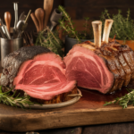 Prime rib and standing rib roast comparison on a cutting board.